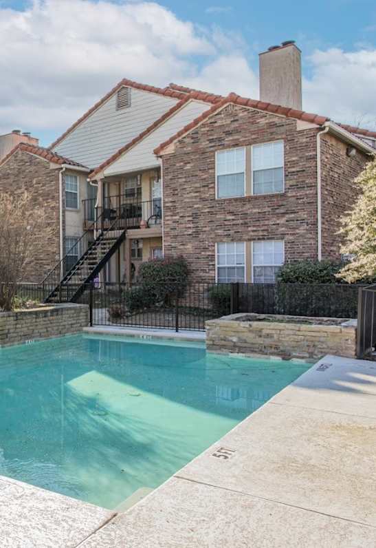 A house with a pool in the backyard.