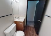 Thumbnail 12 of 19 - Bathroom with sink next to toilet on one side