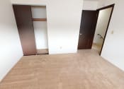 Thumbnail 11 of 19 - Bedroom with carpet and a sliding door closet