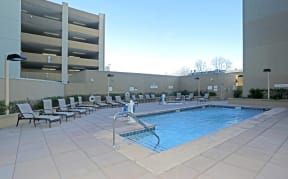 Two-Bedroom Apartments in Sacramento, CA - Community Pool with Lounge Seating and Lights All Around