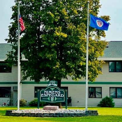 A building with a sign that says "Northern Essex" in front of it.