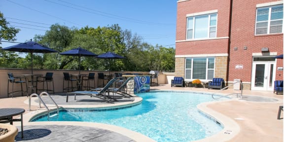 our apartments have a resort style pool with umbrellas