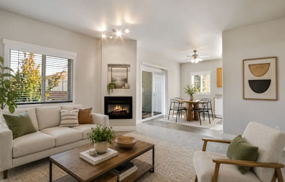 A living room with a fireplace and a couch.