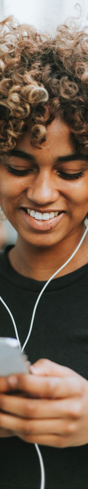 a woman running through a park while listening to her mp3 player