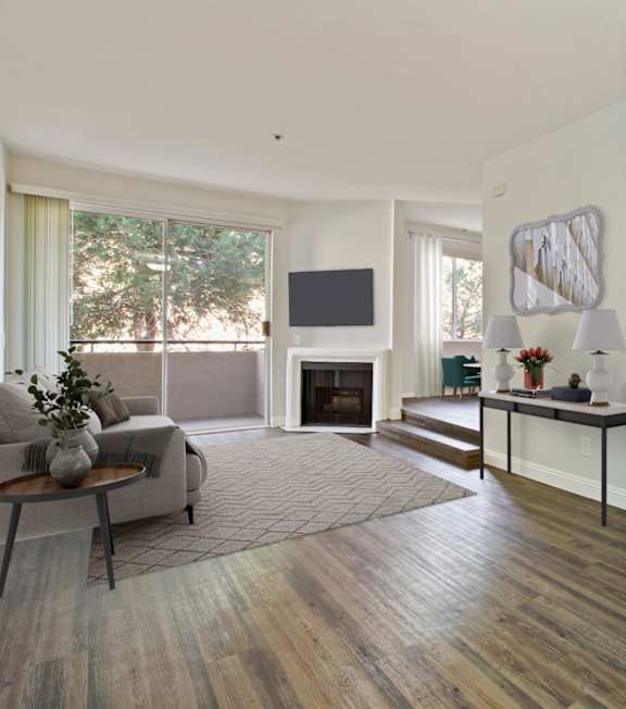 a living room with couches and chairs and a fireplace at Bella Terra Apartments, Henderson