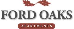 The image is a logo for Ford Oaks Apartments.
