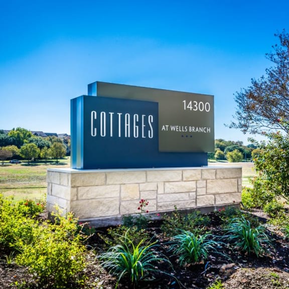the sign at the entrance to the cottage apartments at villa siena