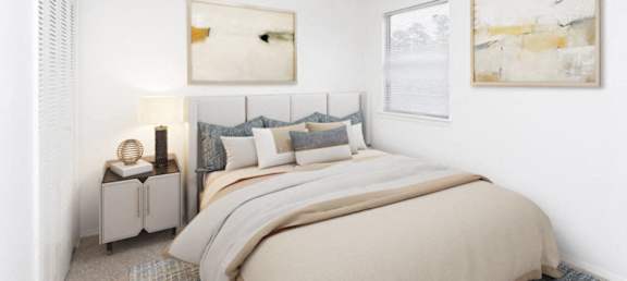 a bedroom with a bed and a ceiling fan