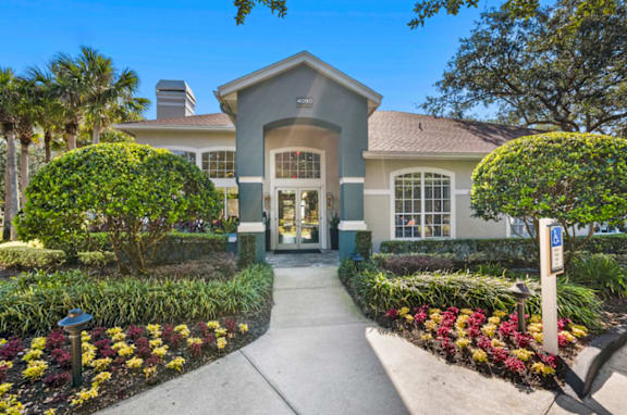 A building with a grey roof and a sign that says  at Country Club Lakes, Jacksonville, FL