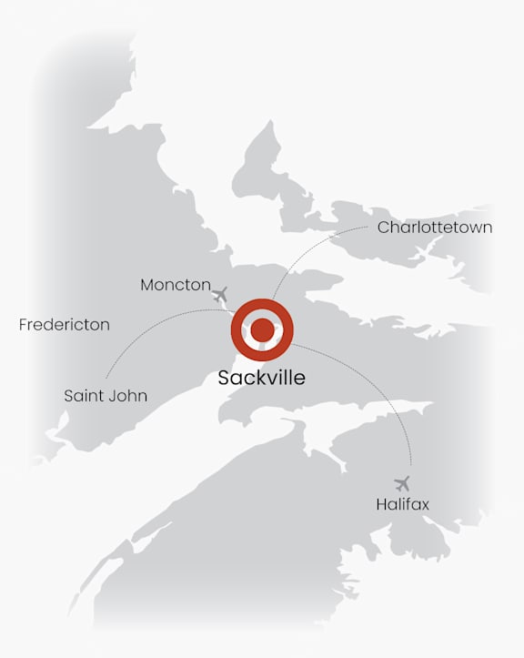 A map with Sackville at the center and other cities like Fredericton, Moncton, Saint John, Charlottetown, and Halifax around it.