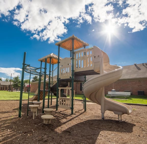 Resident Playground with a Large Slide at Governor Square Apartments in Carmel,  46032