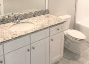 Thumbnail 30 of 60 - B3 (1-car) Master Bath with granite countertops, sink, toilet, and shower