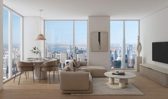 A modern living room with a view of the cityscape outside the large windows.