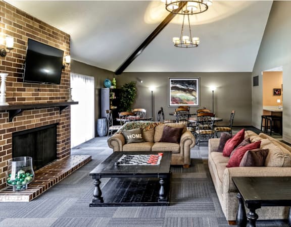 a living room with couches and a fireplace