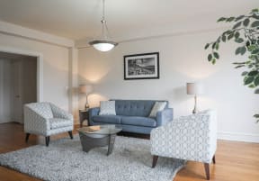 a living room with a couch and two chairs
