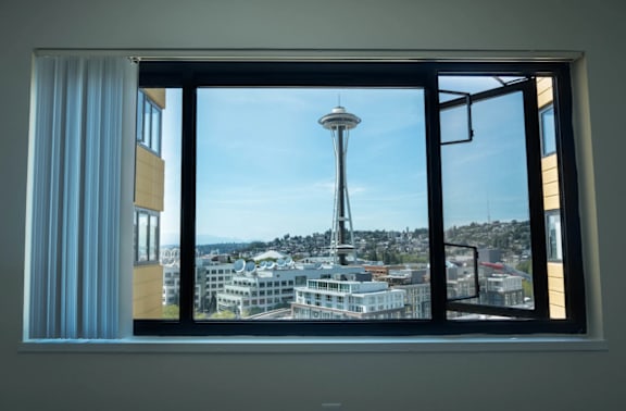 A view of the Seattle Space Needle from a window at Skye at Belltown Apartments, Washington 98121