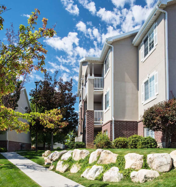 the boulders in front of an apartment building  at Country Oaks Apartments in Utah, 84015