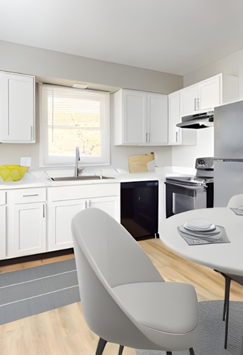A modern kitchen with a dining table and chairs.