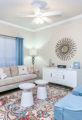 a living room with a couch and two chairs at Northland at the Arboretum, Austin, Texas
