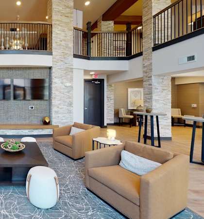 a large living room with couches and a coffee table