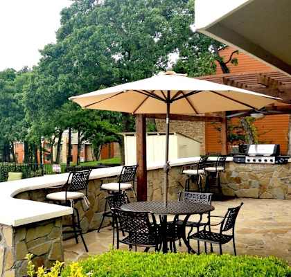 an illustration of a swimming pool with tables and umbrellas
