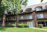 our apartments are located in a large brick building with balconies at Waldo Heights, Kansas City, 64131
