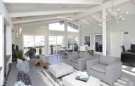 A living room with a grey couch and a coffee table. at The Township, Missouri
