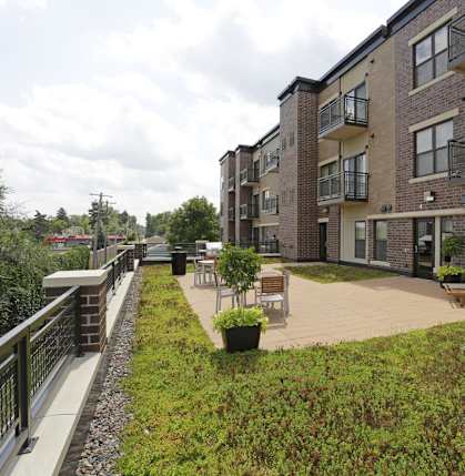 Apartment complex with a patio.