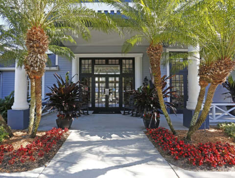 Leasing Office Exterior with Sidewalk and Plants