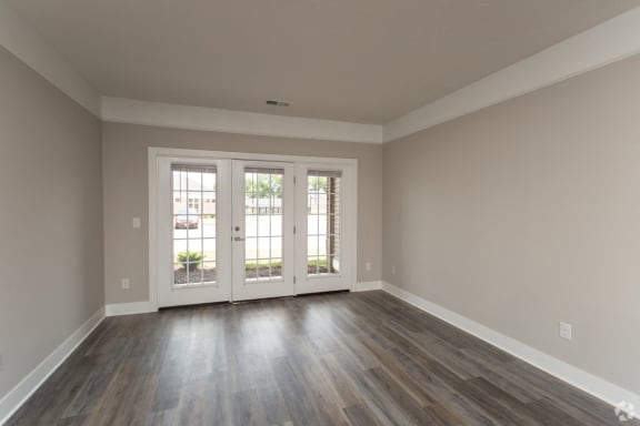 The Ervin Living Room with Gorgeous French Doors  at The Flats on Houk, Delaware, OH, 43015
