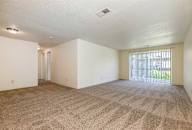 an empty living room with a sliding glass door at Waldo Heights, Missouri