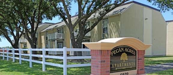 a picture of the pecan acres apartments sign