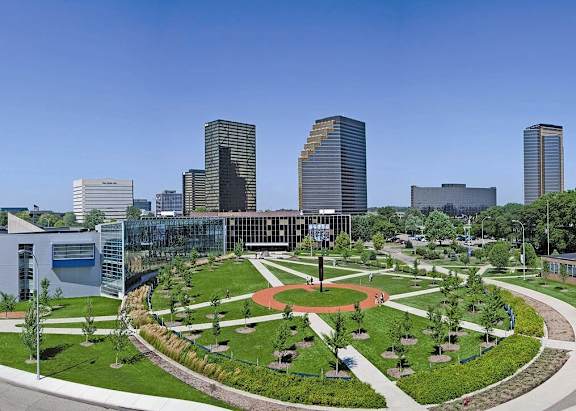 a view of a park with a city in the background