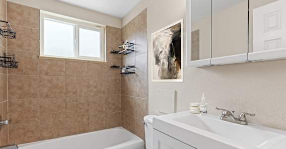 Bottom cabinet in bathroom at Kingsbrook Arms, Englewood, 80113