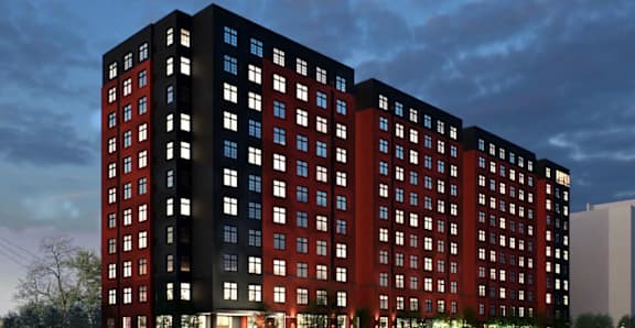 A large red and black building with many windows.