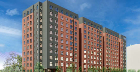 A large building with many windows is shown in this image. at University Commons in Pittsburgh, PA