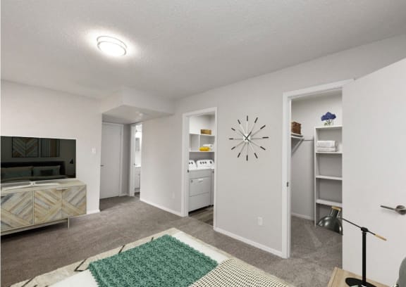 a living room with a couch and a wall clock