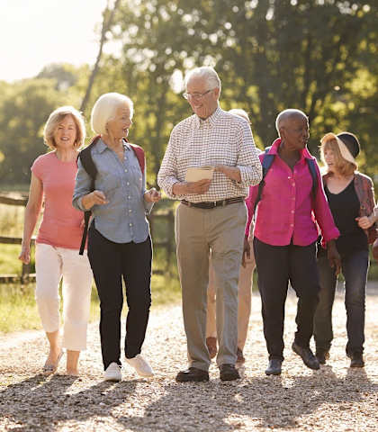 a group of people walking on a path at Mariposa at Elk Drive, Burleson, TX 76028