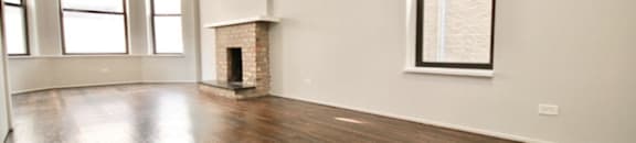Spacious living area with real hard-wood flooring