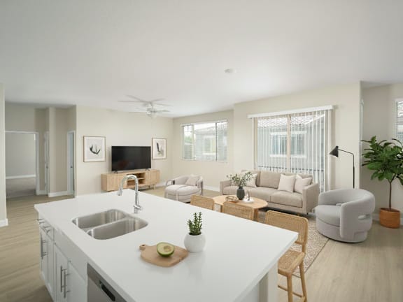 A modern kitchen with a white countertop and a wooden cutting board on it.