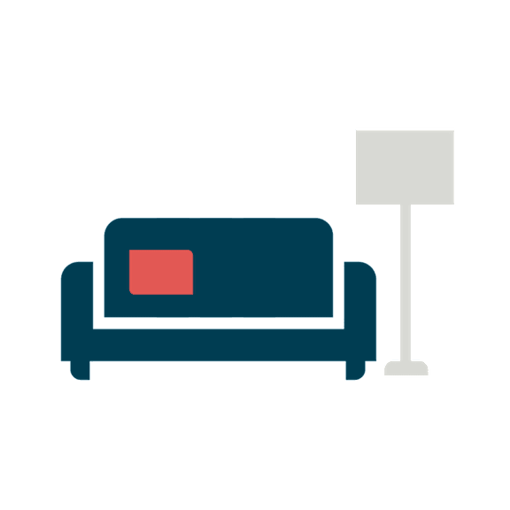 A blue sofa with a red square on it and a white floor lamp.