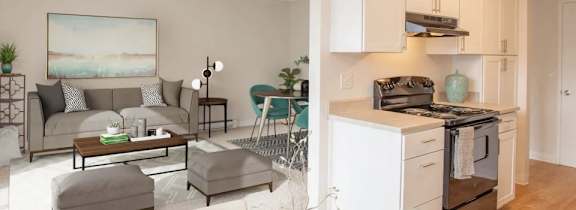 A modern living room with a grey couch and a coffee table.