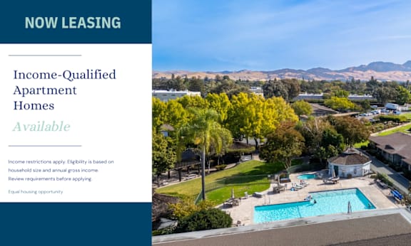 A brochure for income-qualified apartment homes is displayed.