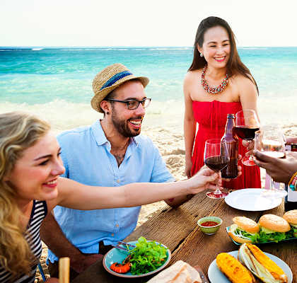 Friends dining at the beach at Clipper Bay, Florida, 33616