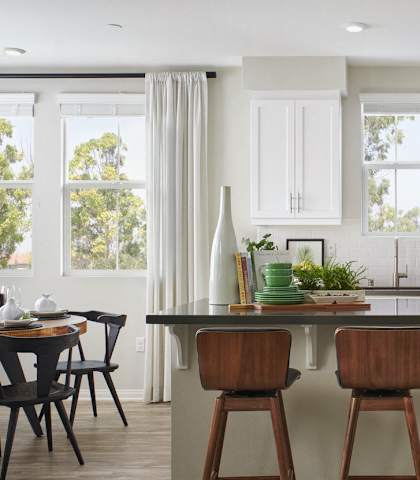 1-Bedroom Apartments Near University of California, Riverside - Lincoln Village - Kitchen With Large Island Seating, Shaker Cabinets, Subway Tile Backsplash, And Stainless Steel Appliances.