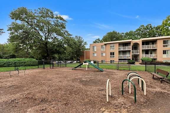 our apartments have a playground and a building with trees
