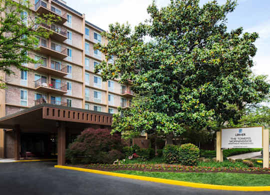 The Towers at Morris Park is a large apartment complex with a well-maintained entrance and landscaping.
