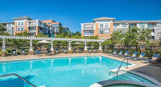 the swimming pool at the preserve at polo towers apartments tx