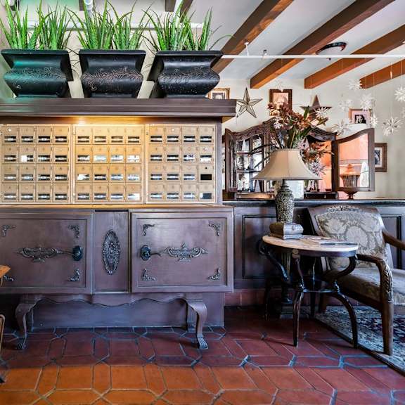 an empty restaurant with wooden tables and chairs