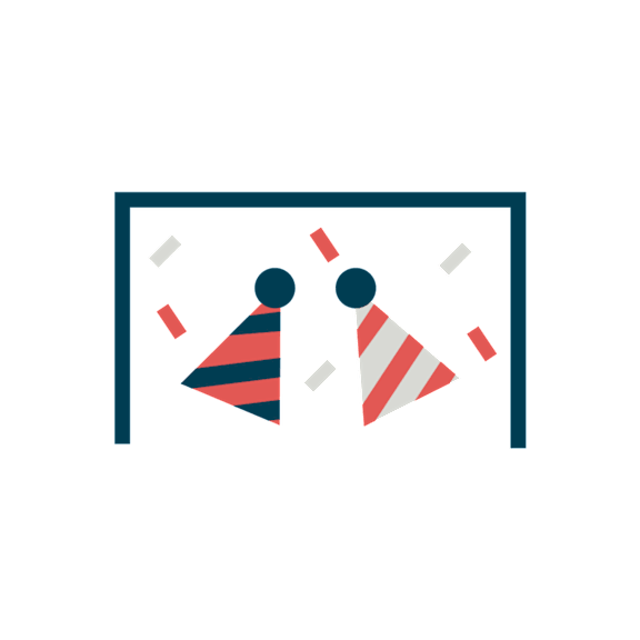 Two people wearing party hats are standing in front of a black background.